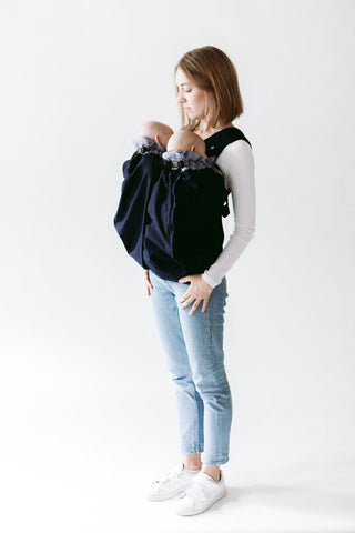 Woman carrying twins in Weego TWINS baby carrier. Frontal View.